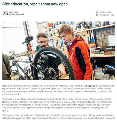 Screenshot of the Source Article Bike Education Repair Room Now Open with a hero image of a bike mechanic showing a student how to fix a wheel.
